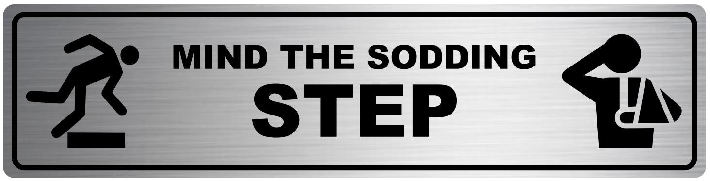 Mind the Sodding Step Safety Sign. Exterior Grade Self Adhesive, Easy to Install – by North By North East – Safety & Warning Signs